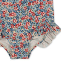 konges-slojd-manuca-ls-frill-swimsuit-rosie-blue-kong-s24ks100382-rb-12m