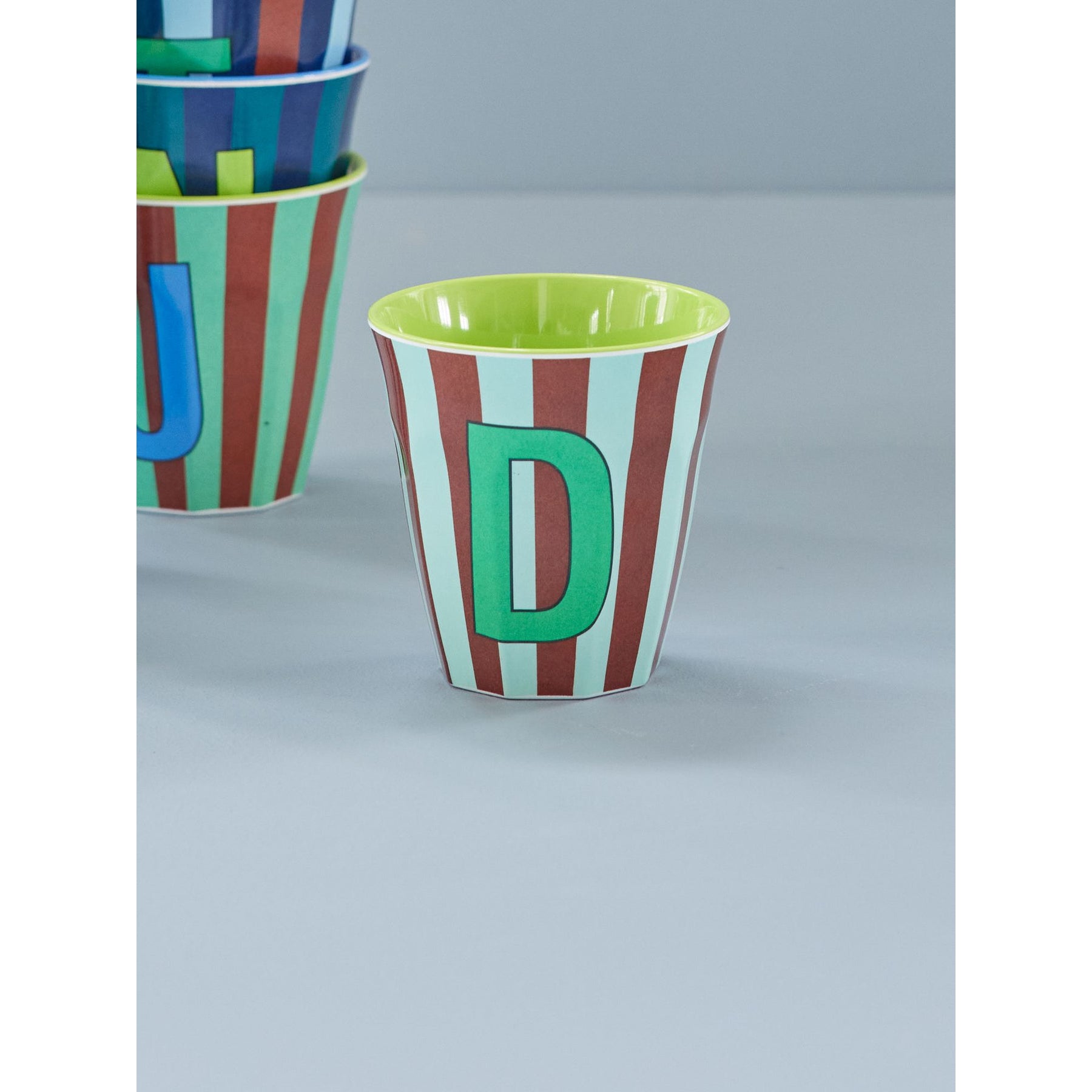 rice-dk-melamine-cup-with-the-letter-d-stripes-blueish-medium-250ml-rice-melcu-alpstrdb