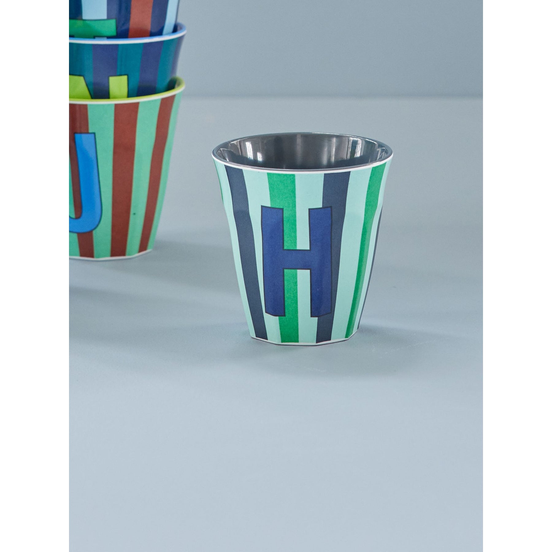 rice-dk-melamine-cup-with-the-letter-h-stripes-blueish-medium-250ml-rice-melcu-alpstrhb
