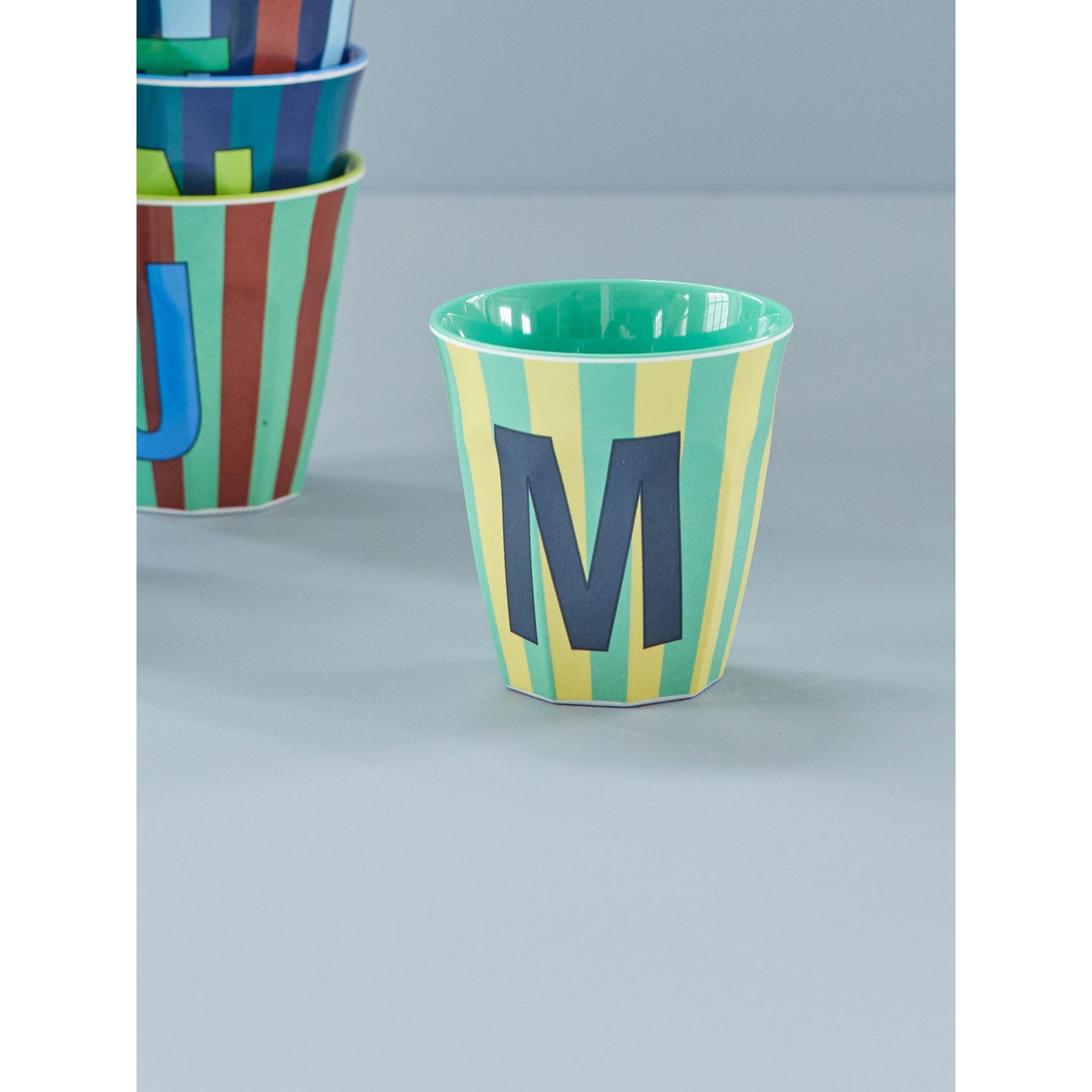 rice-dk-melamine-cup-with-the-letter-m-stripes-blueish-medium-250ml-rice-melcu-alpstrmb